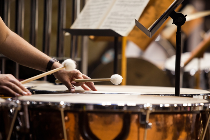 Someone playing the timpani. Representing percussion and world music lessons at sfe music school